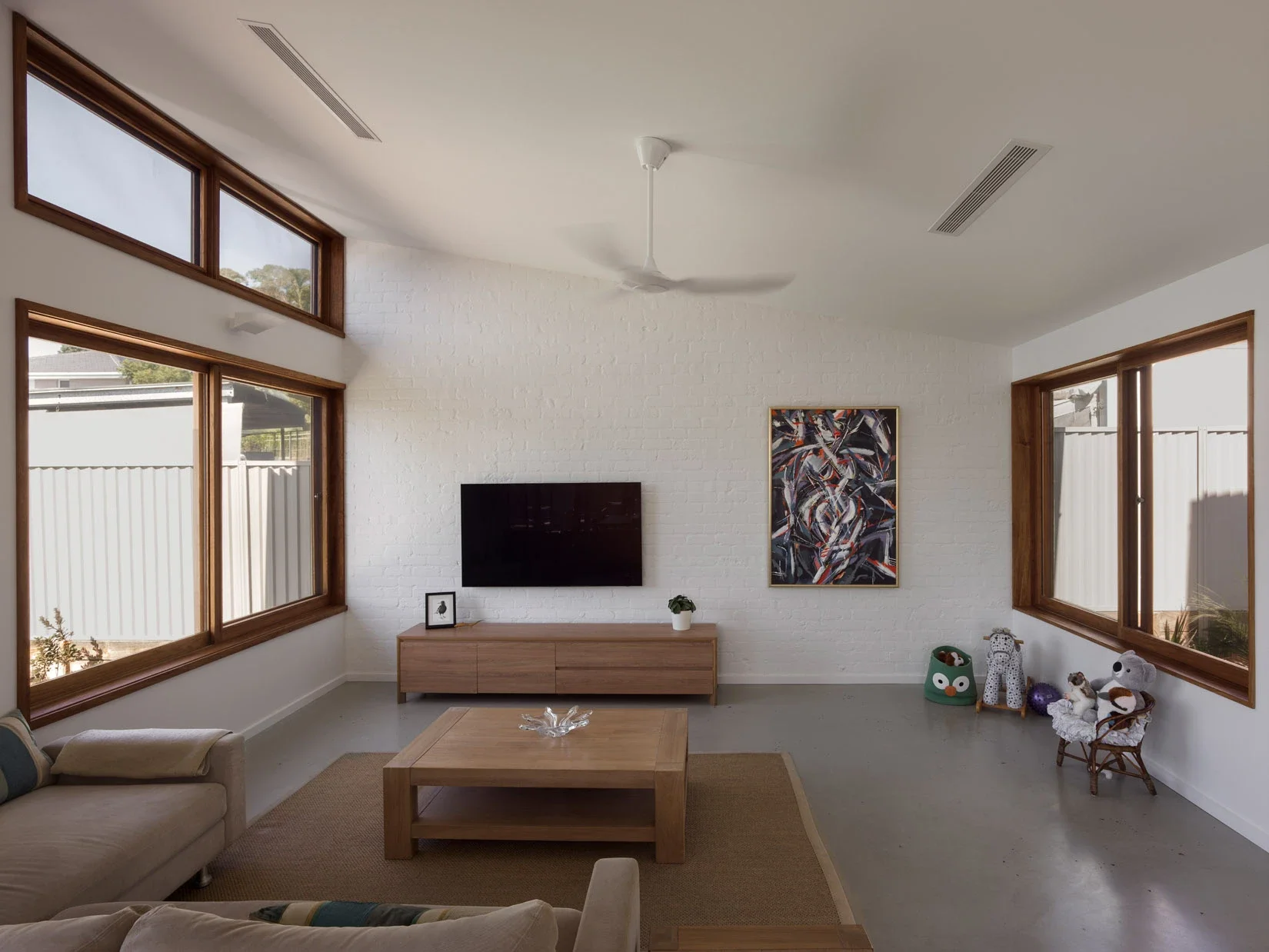 Minimalist living room with timber details in a new home of Sydney