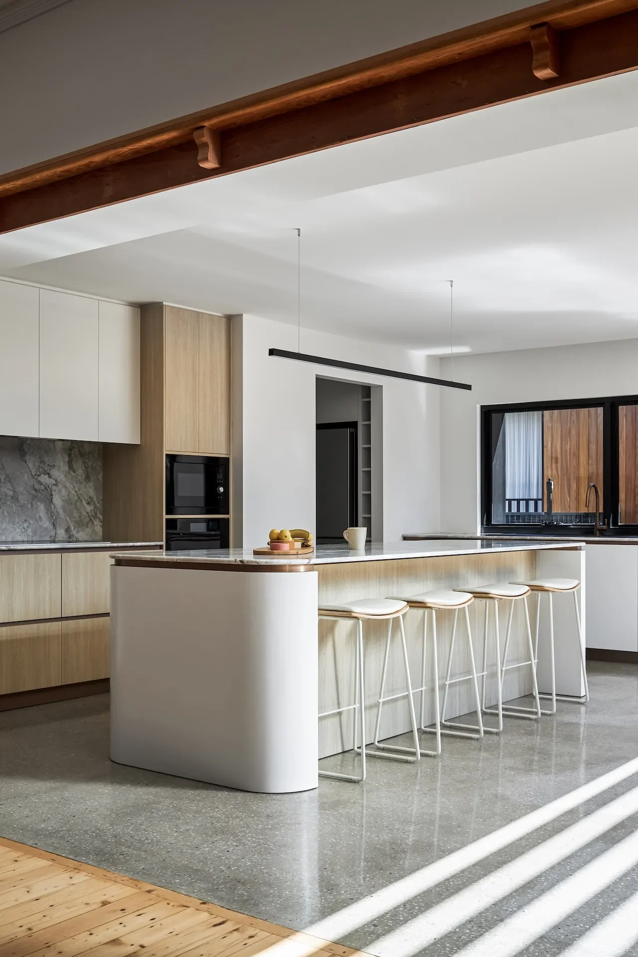 Custom kitchen island and joinery designed for family living in a contemporary St Ives home.