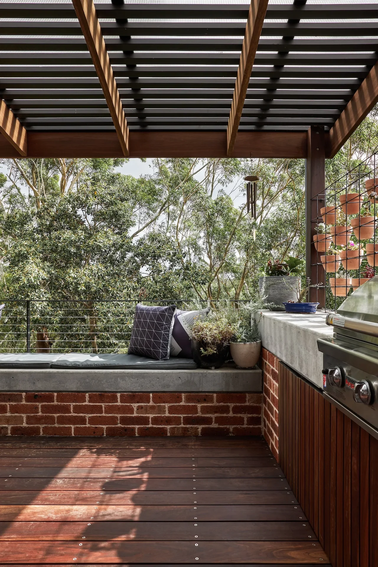 Outdoor living and entertaining area designed by an architect in Gordon, surrounded by trees