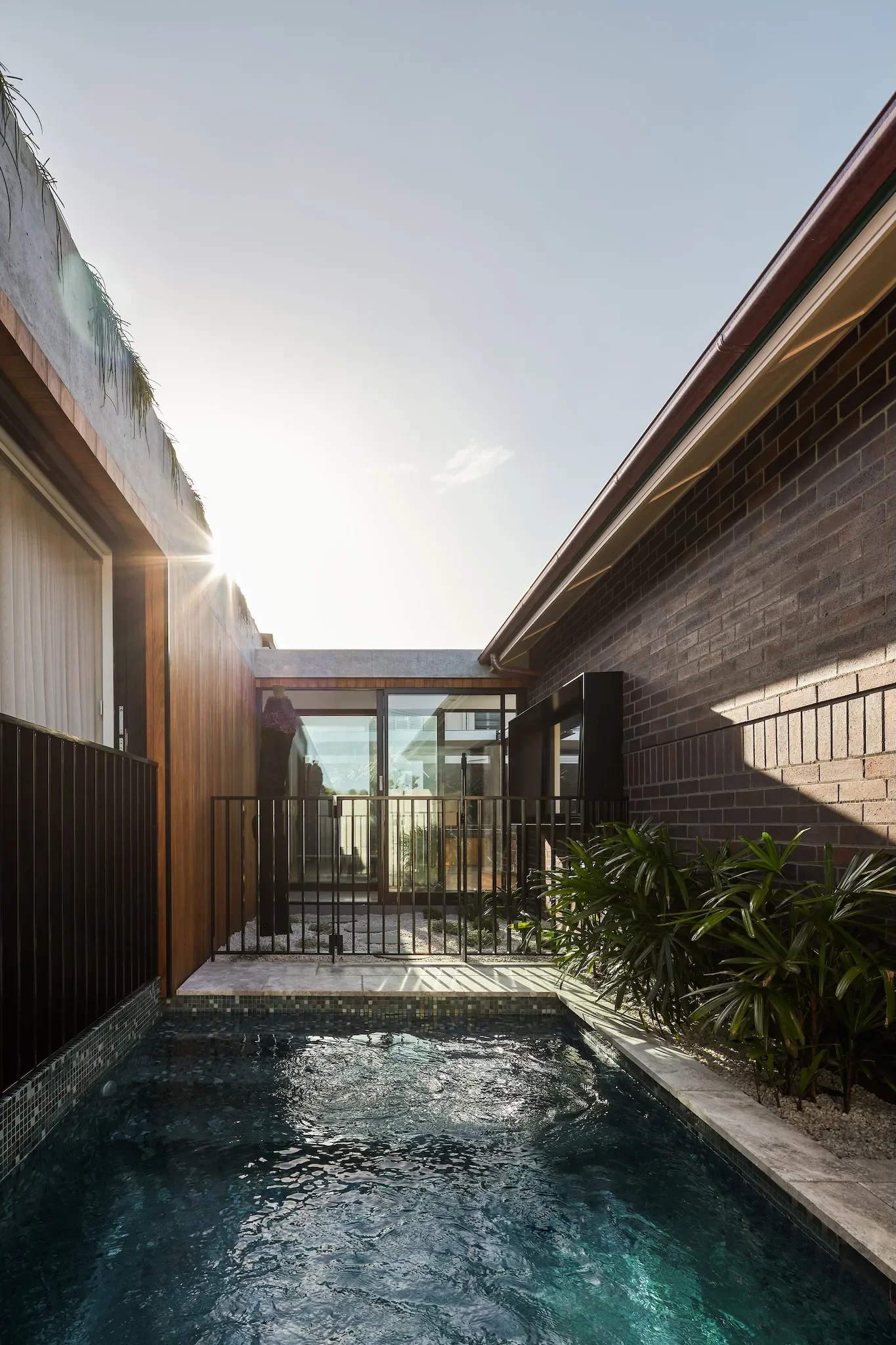 Courtyard home design in Roseville with pool and natural light