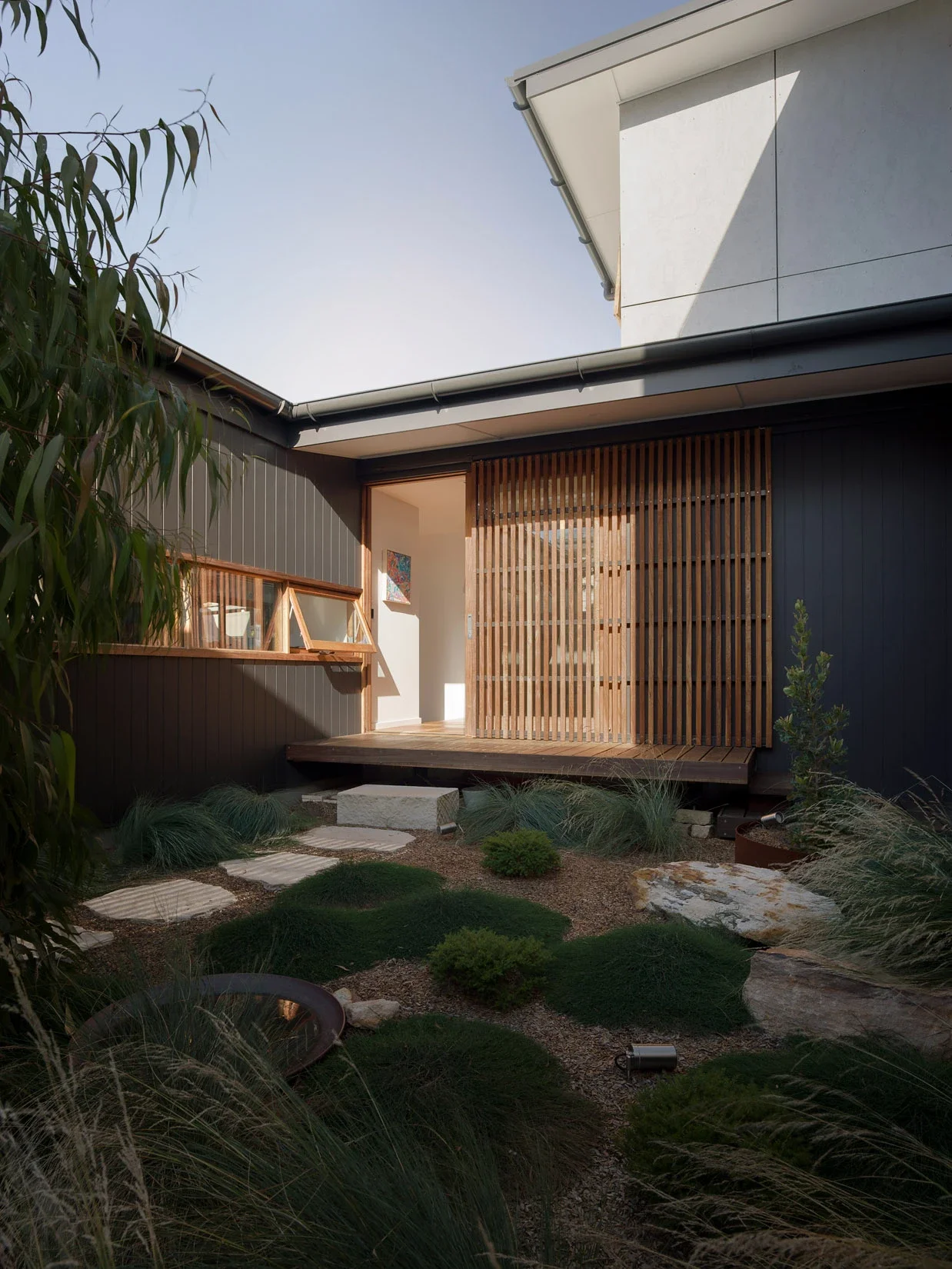 Home integrated with native landscape planting