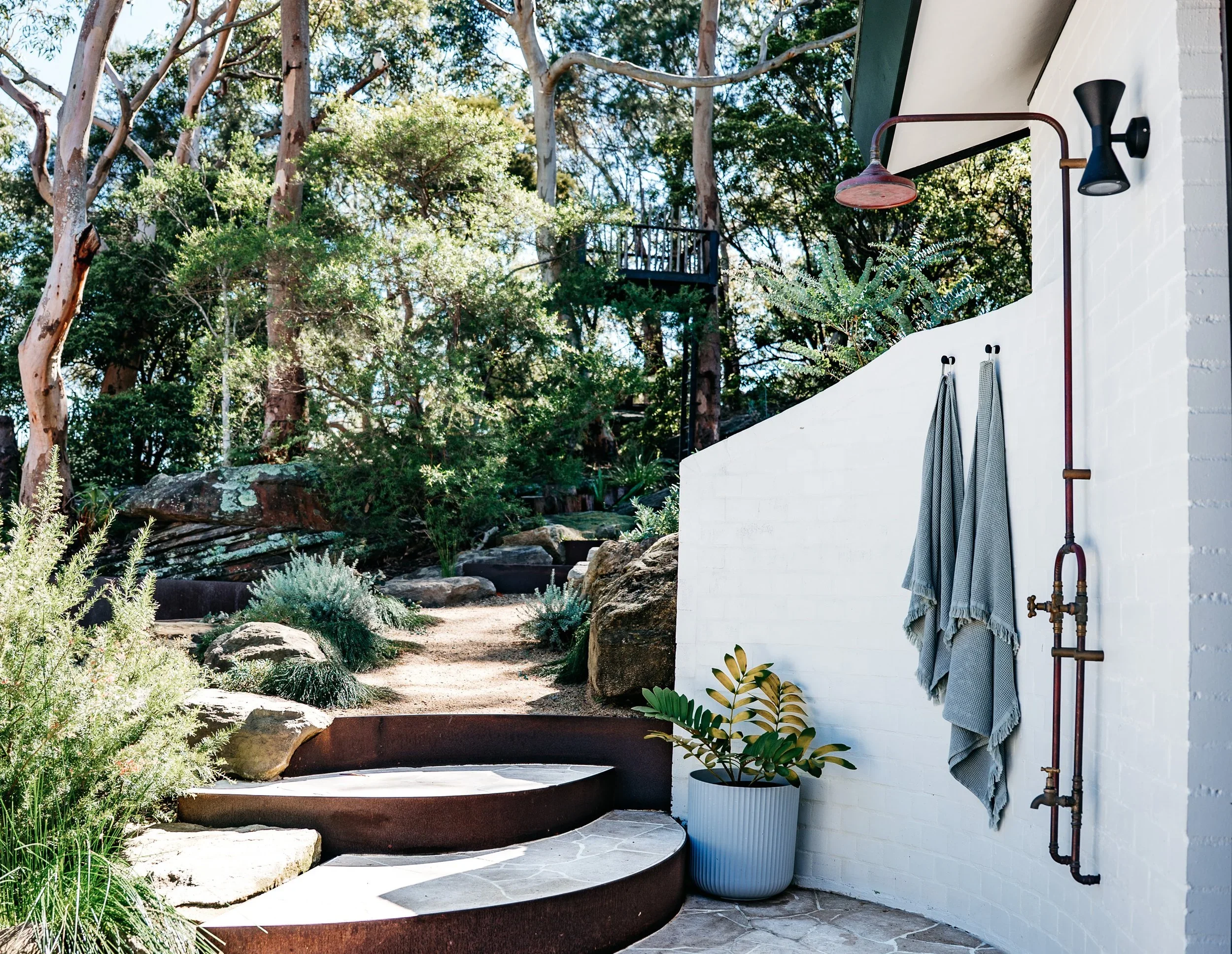 Outdoor shower surrounded by bushland on Scotland Island