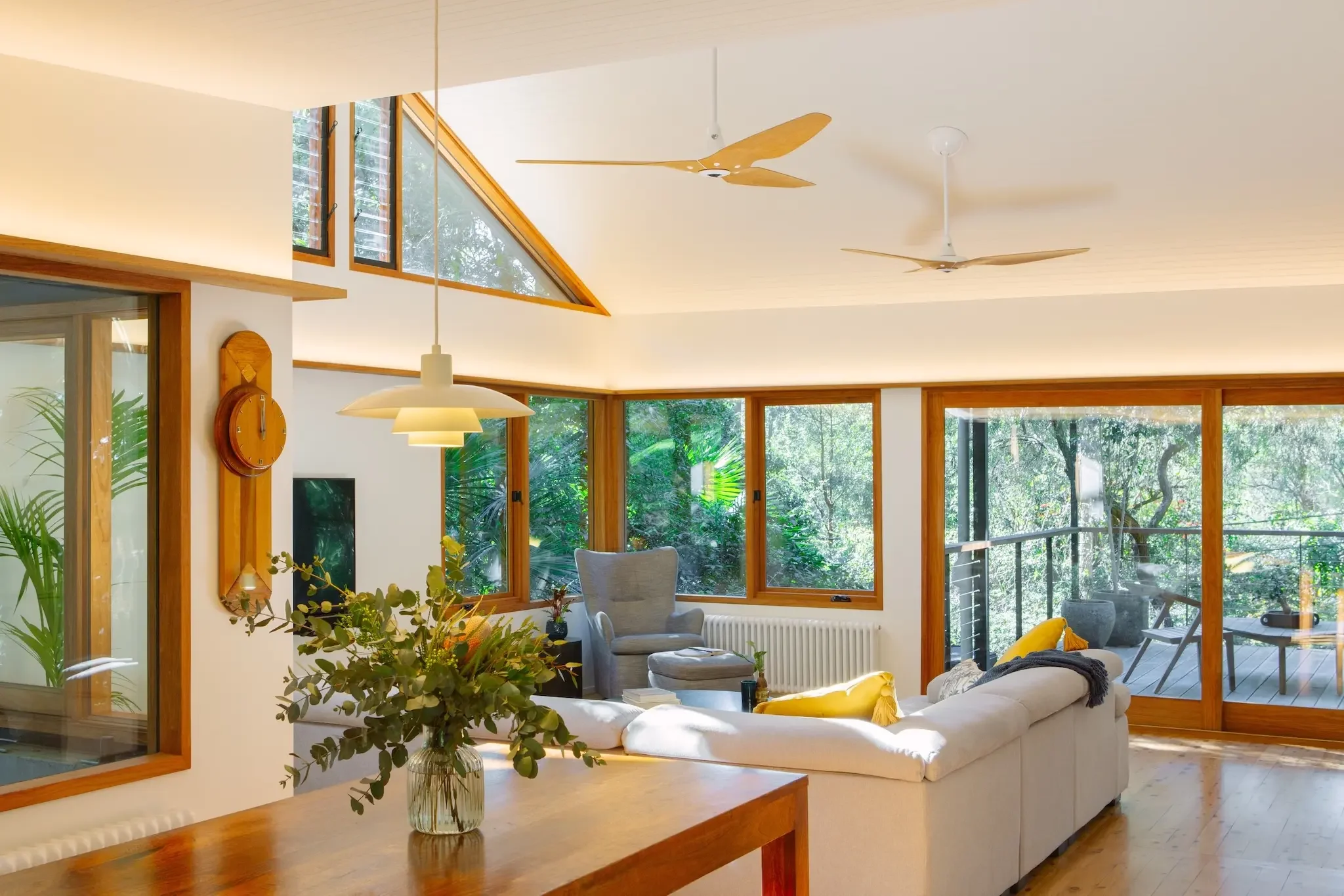 Open plan living space in bush house