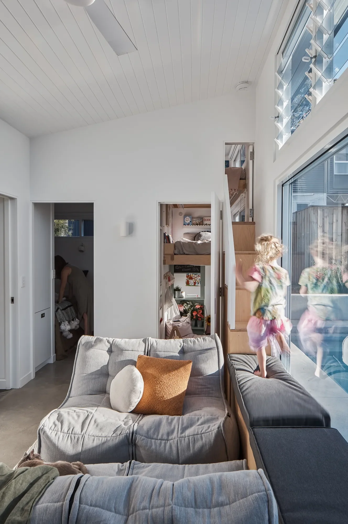 Small passive home interior with natural materials and efficient spatial planning