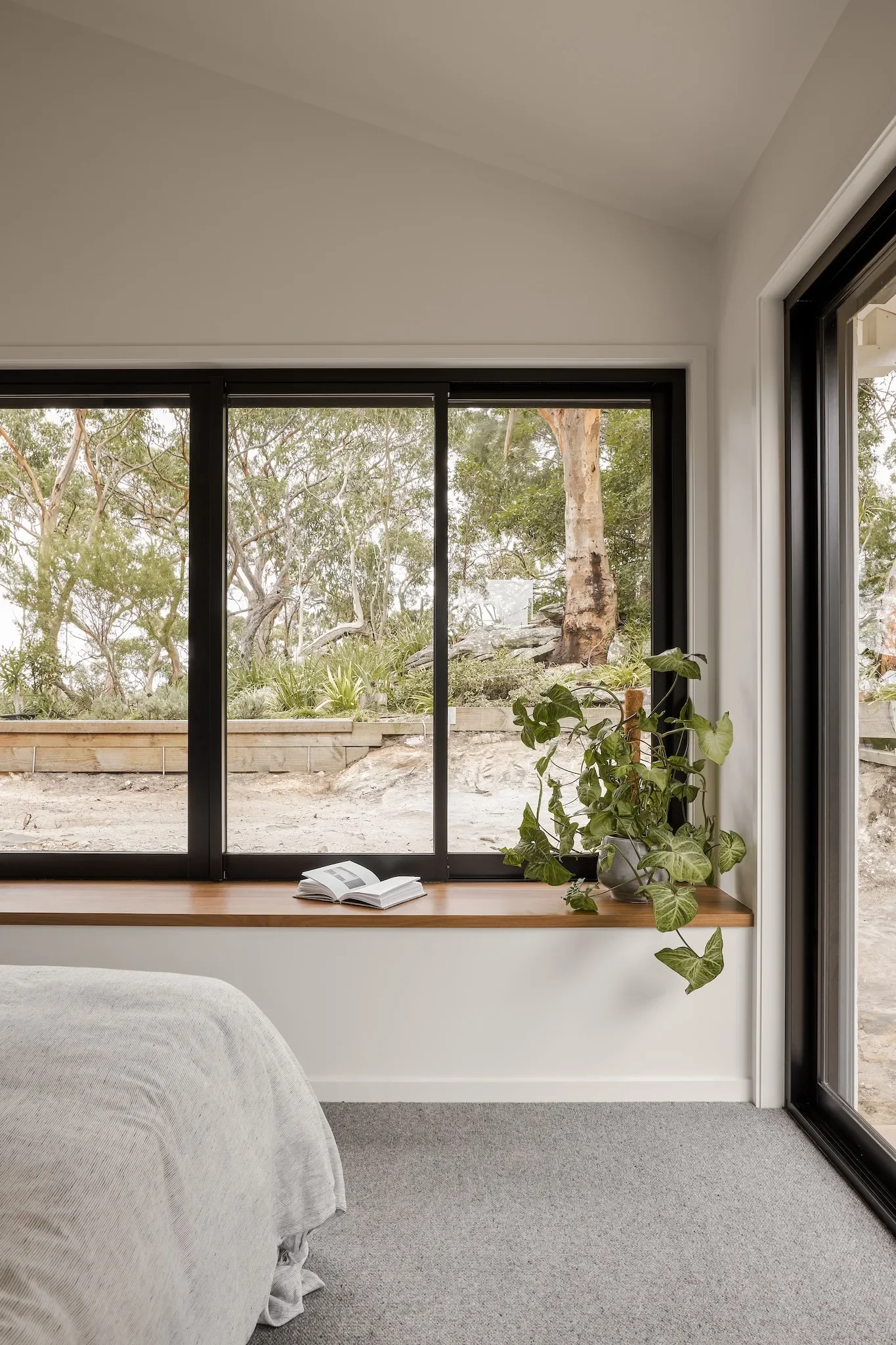 Bedroom with natural light and bush view