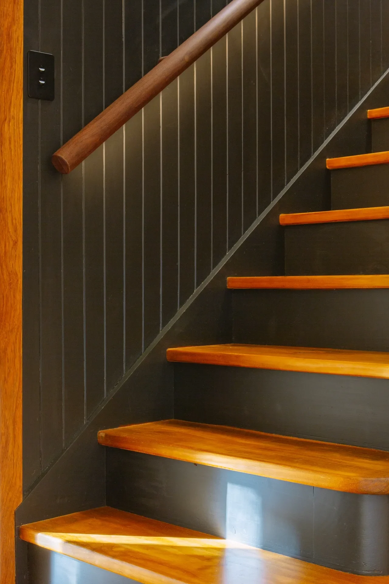 Timber staircase with simple detailing, designed as part of a modern residential interior.