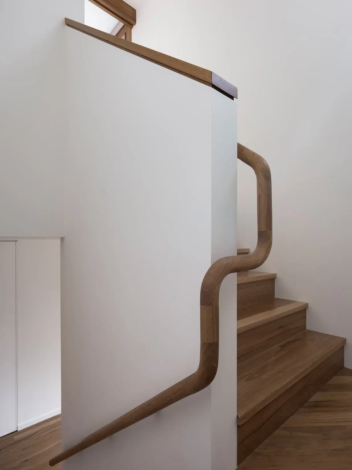 Staircase handrail architectural detail at Beela House