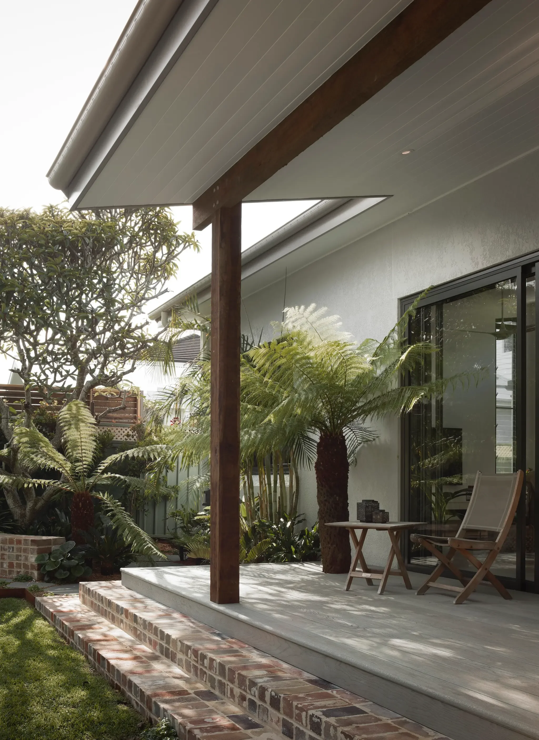 Single-storey home renovation opening onto a garden terrace, indoor–outdoor living designed by Ironbark Architecture