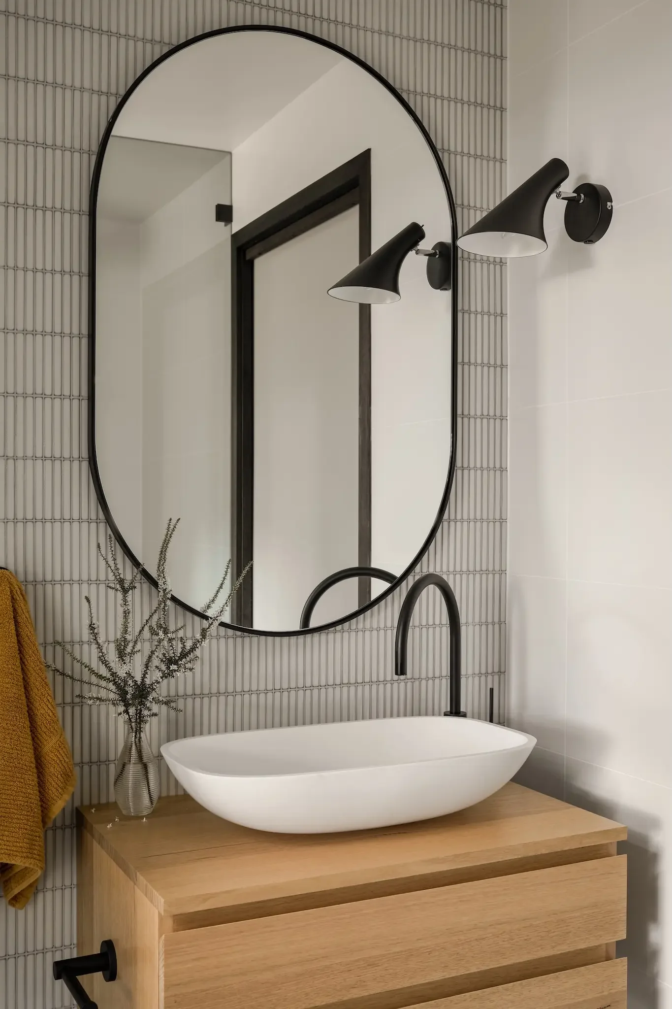 Minimal bathroom renovation in a Pettit and Sevitt house by Ironbark Architecture