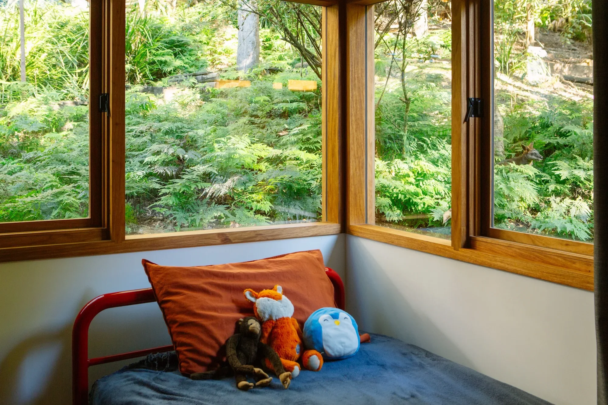 Kid bedroom surrounded by native nature in a sustainable home near Sydney