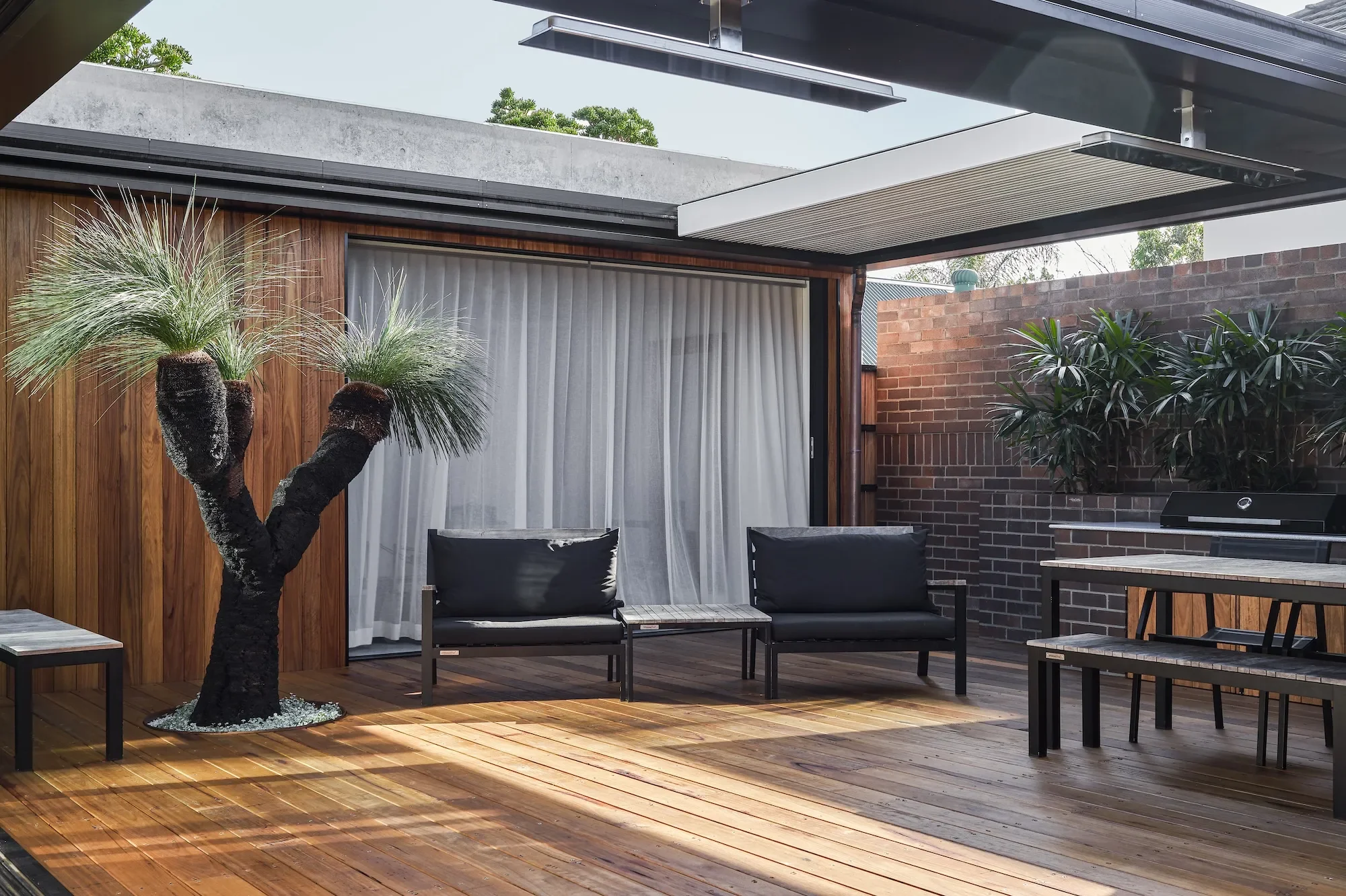 Courtyard home design in Northbridge with landscaped outdoor area and passive cooling