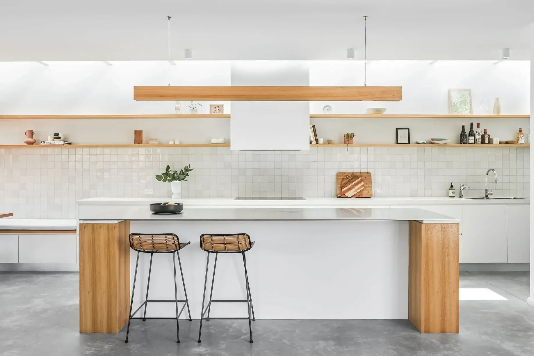 Minimal kitchen design in Northbridge Sydney with natural timber joinery and skylight