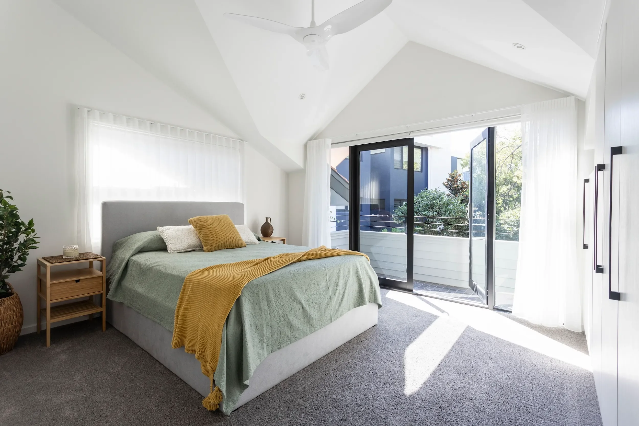 Bedroom with natural light in waterfront home
