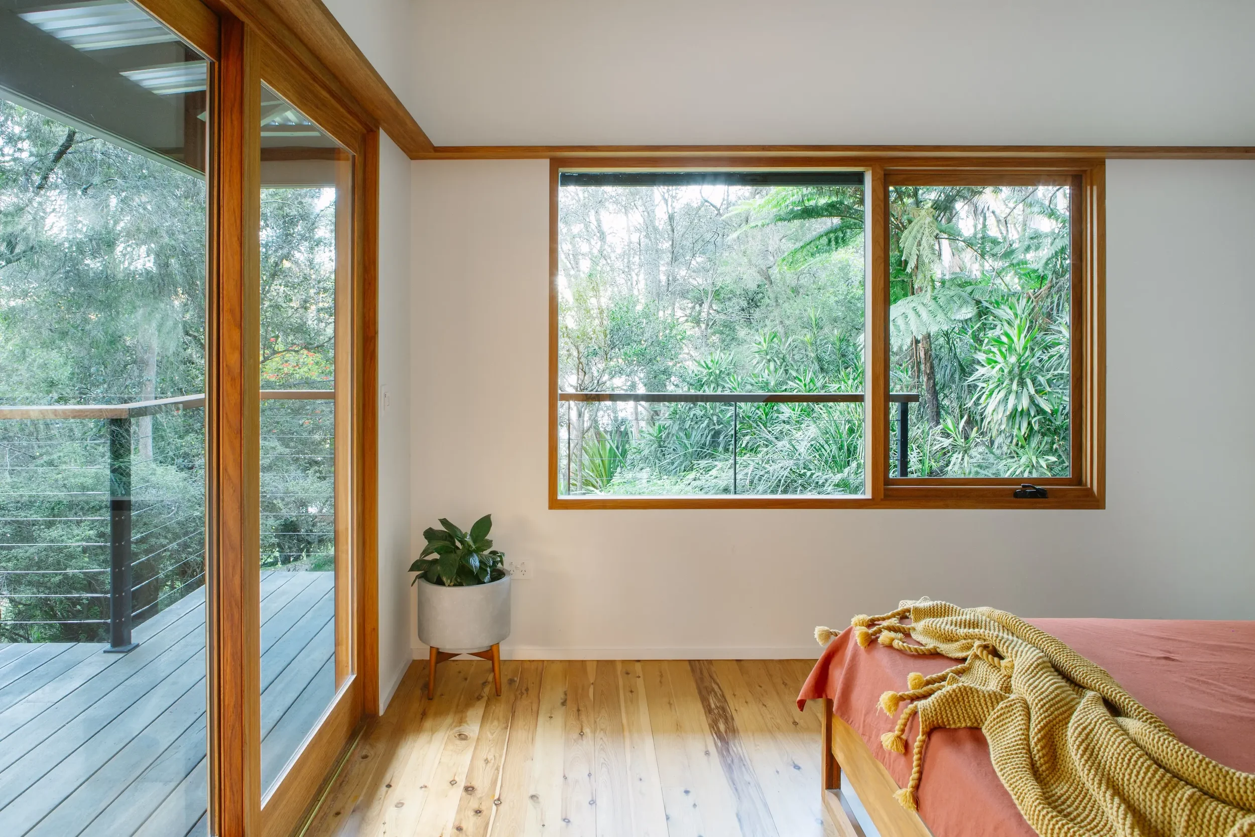 Timber bedroom interior in bush house