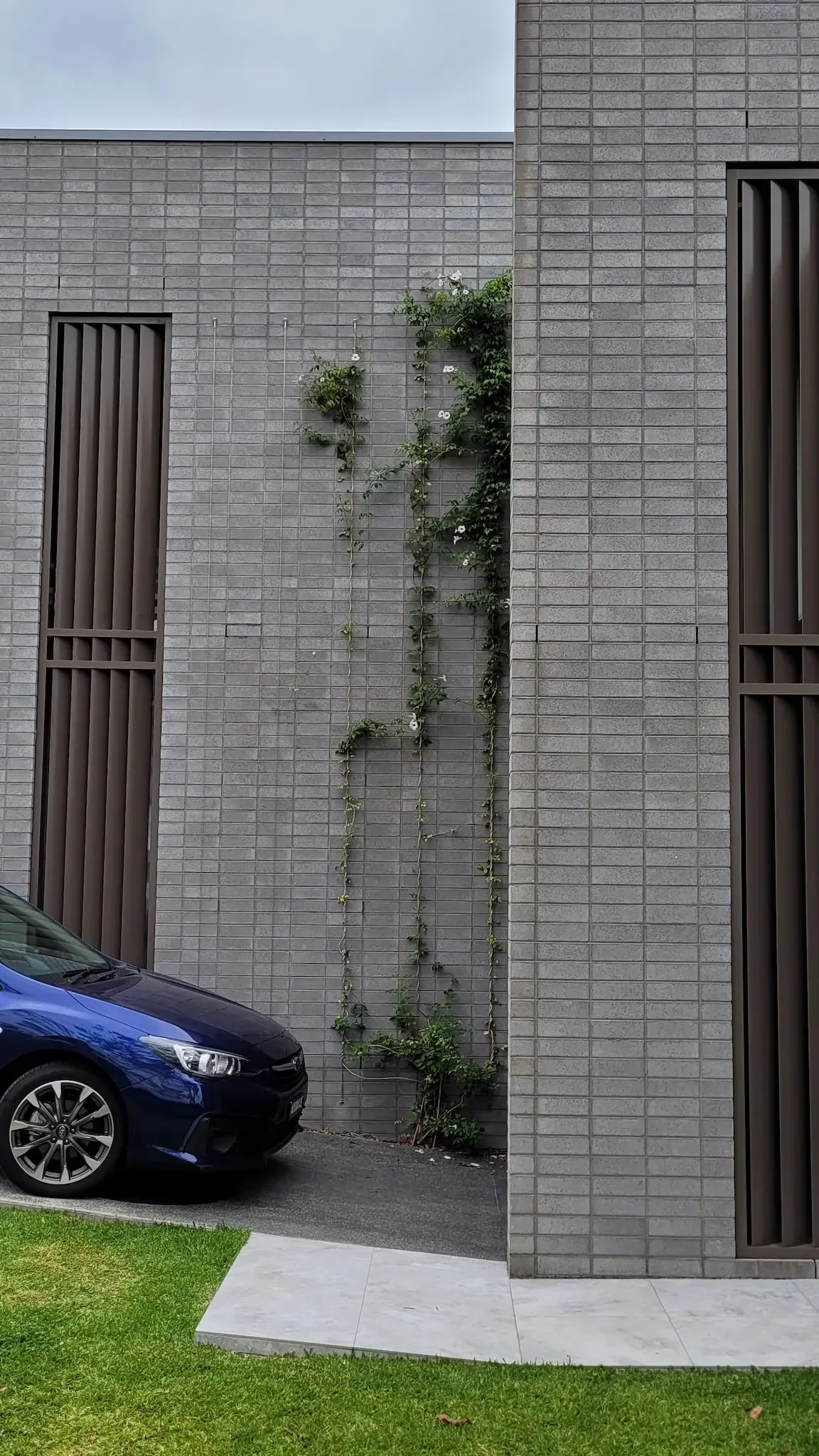 Concrete brick facade of dual occupancy home