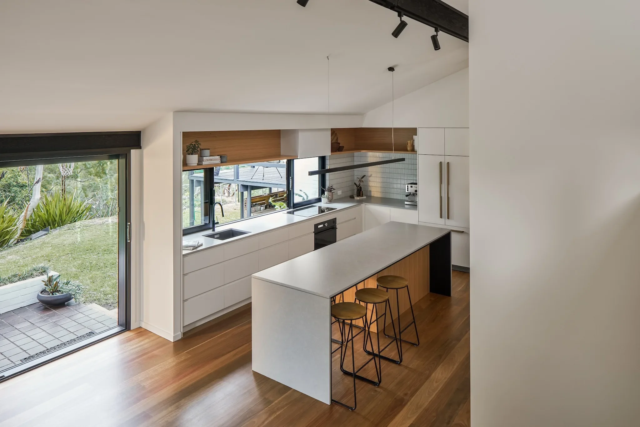 Open plan kitchen and living in bush house