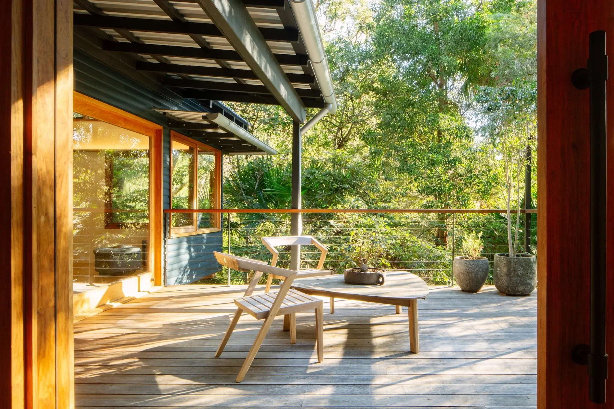 Outdoor living area overlooking native bush