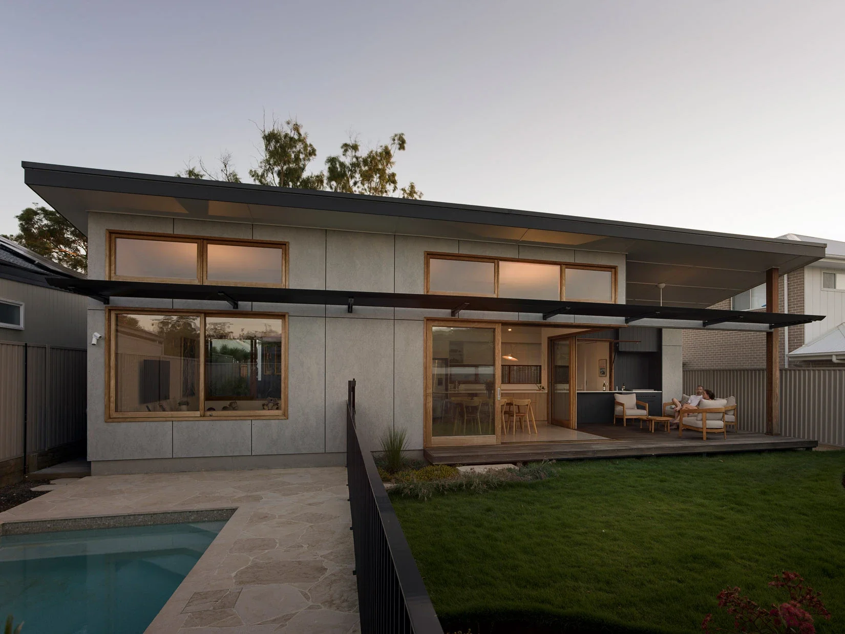 Pavilion-style home exterior at dusk in Sydney
