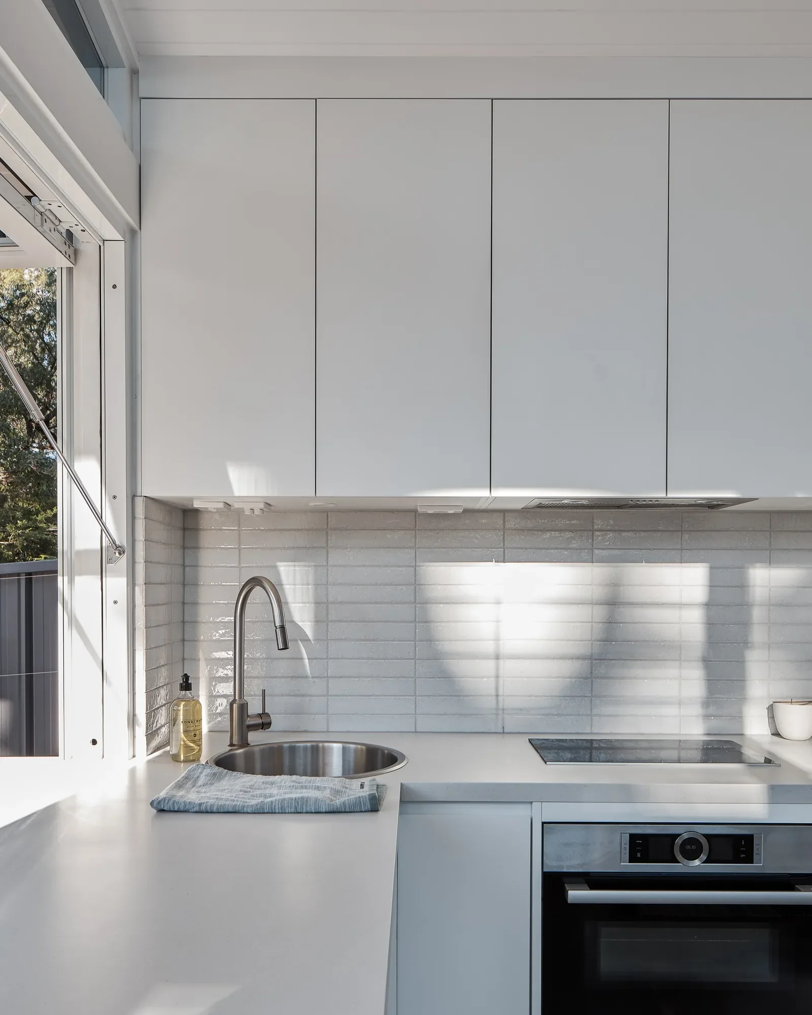 Modern compact kitchen in tiny home