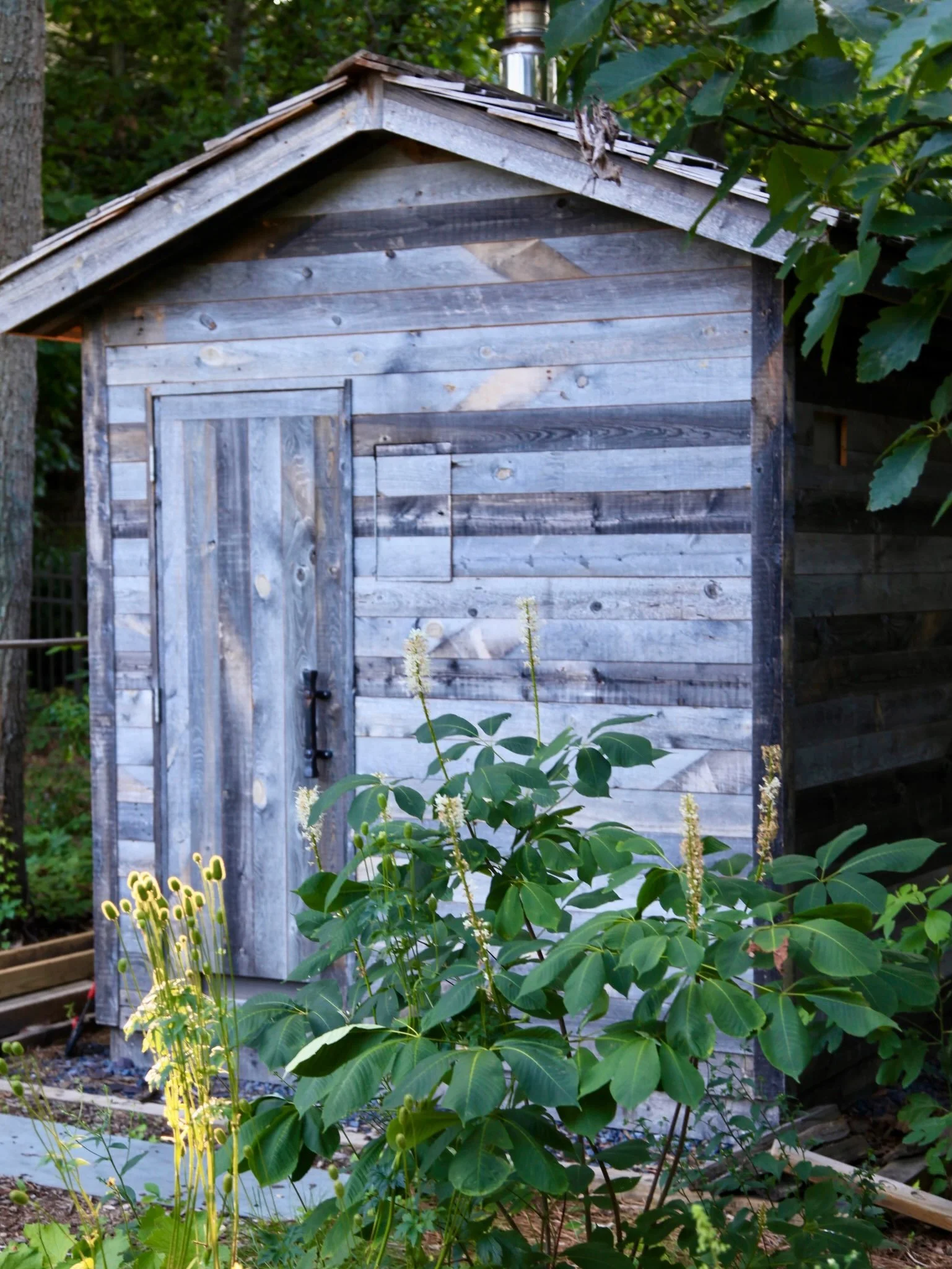 Happy 1st Birthday to this woodsy haven tucked into the back of an otherwise unassuming NJ housing development.

The elements for a magical refuge were already here; fire pit, screened porch and wood fired sauna (build by this incredibly handy homeow