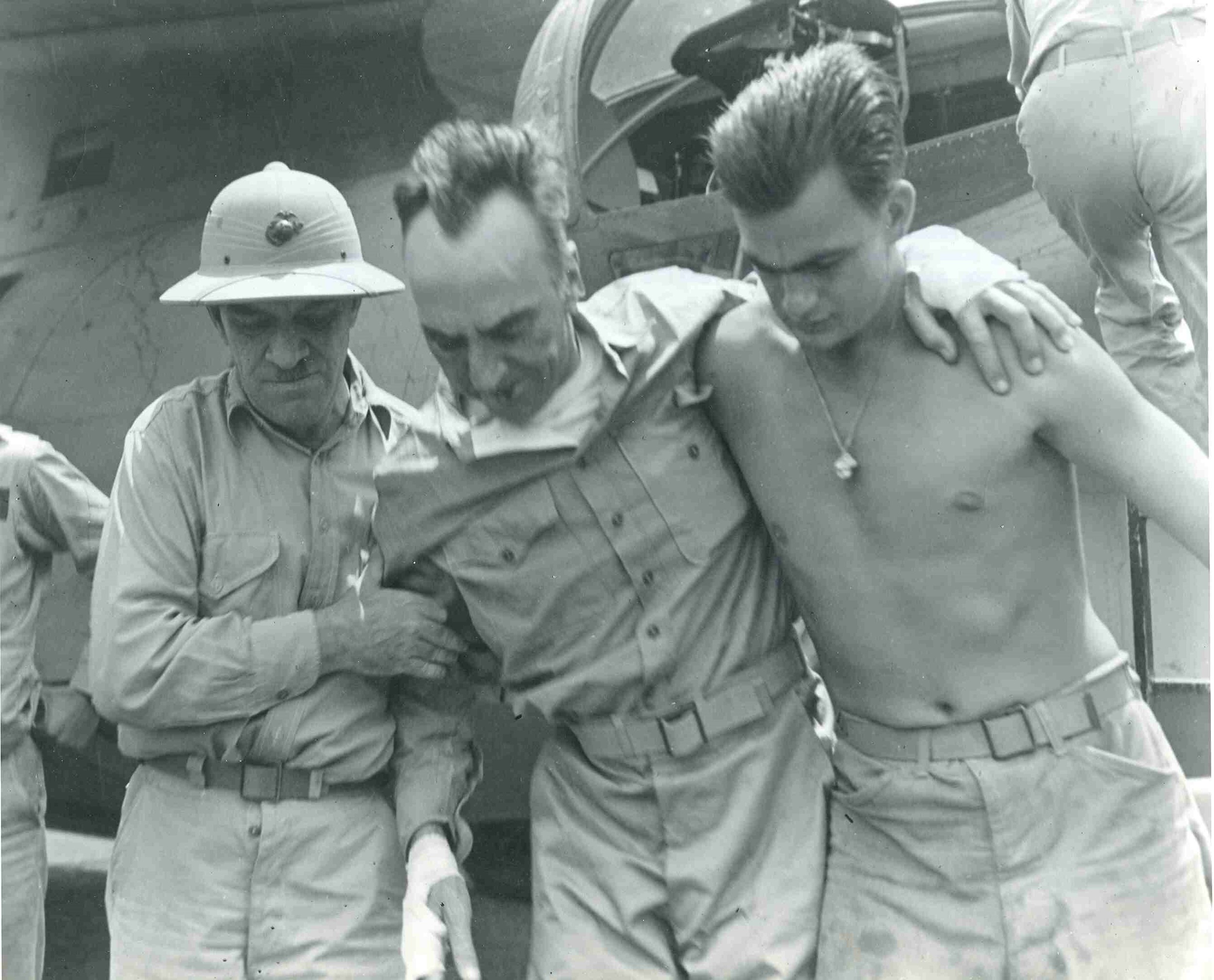 Photograph of Hawley pith helmet on solider during a rescue mission.