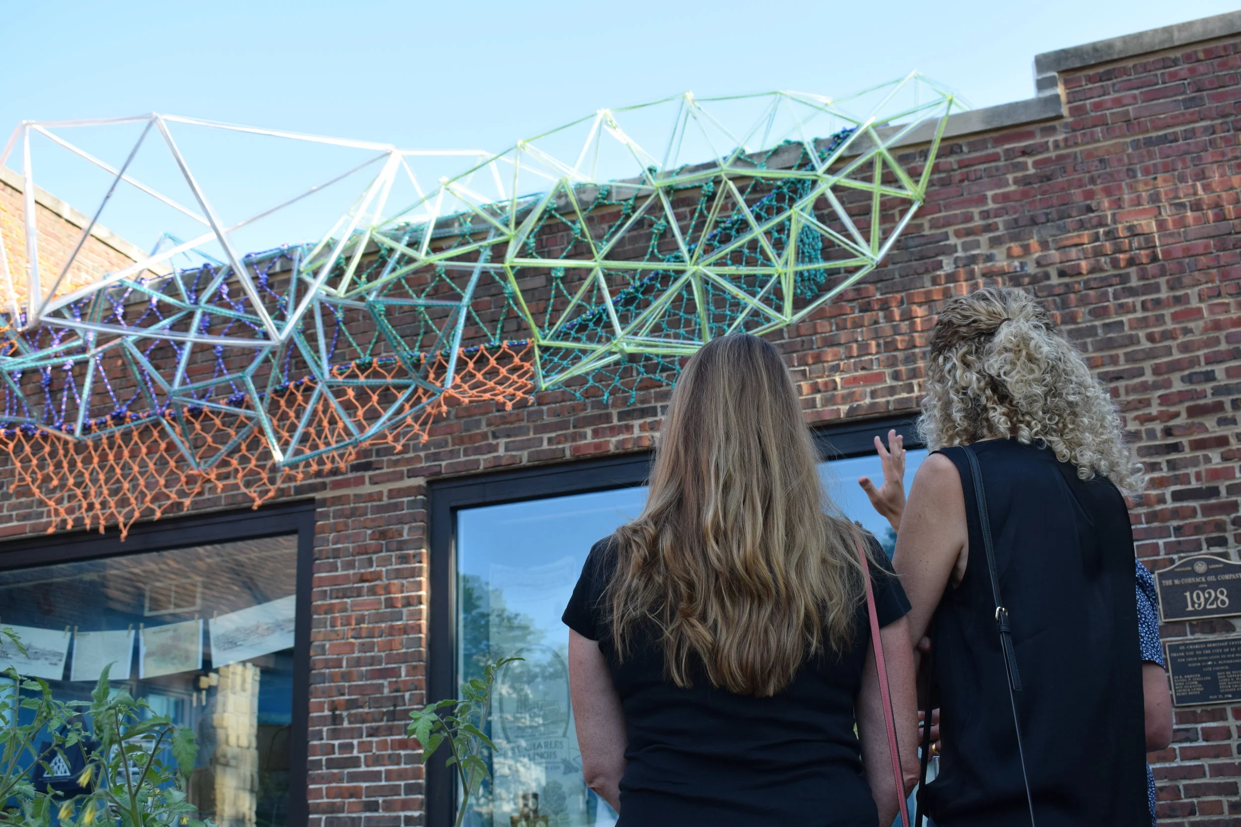 Visitors view Synapses 4: Community at the ArtsFest Opening Reception at the Museum on September 5