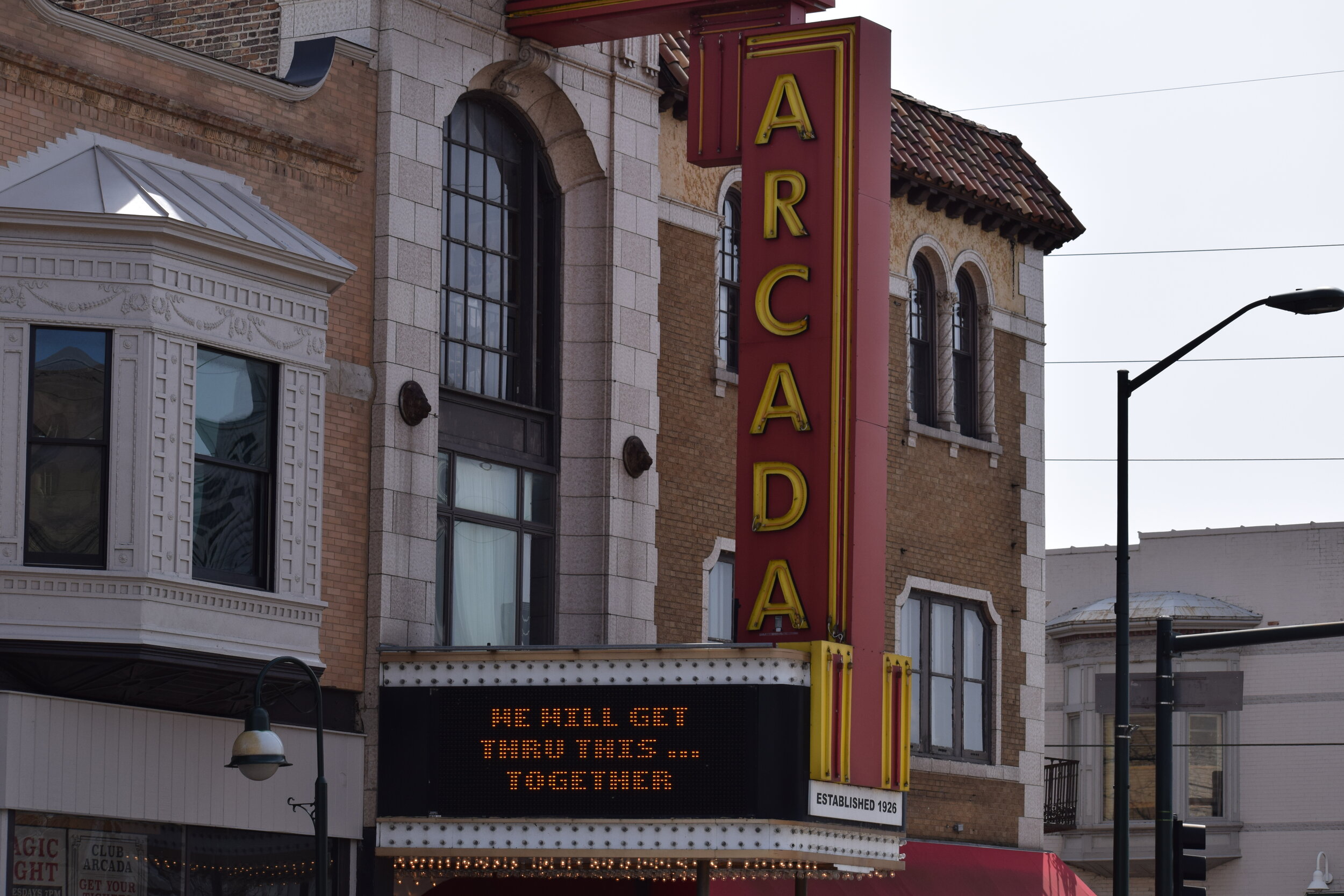 The marquee of the Arcada has encouraged residents and visitors to stay strong and pitch in together during COVID. TK