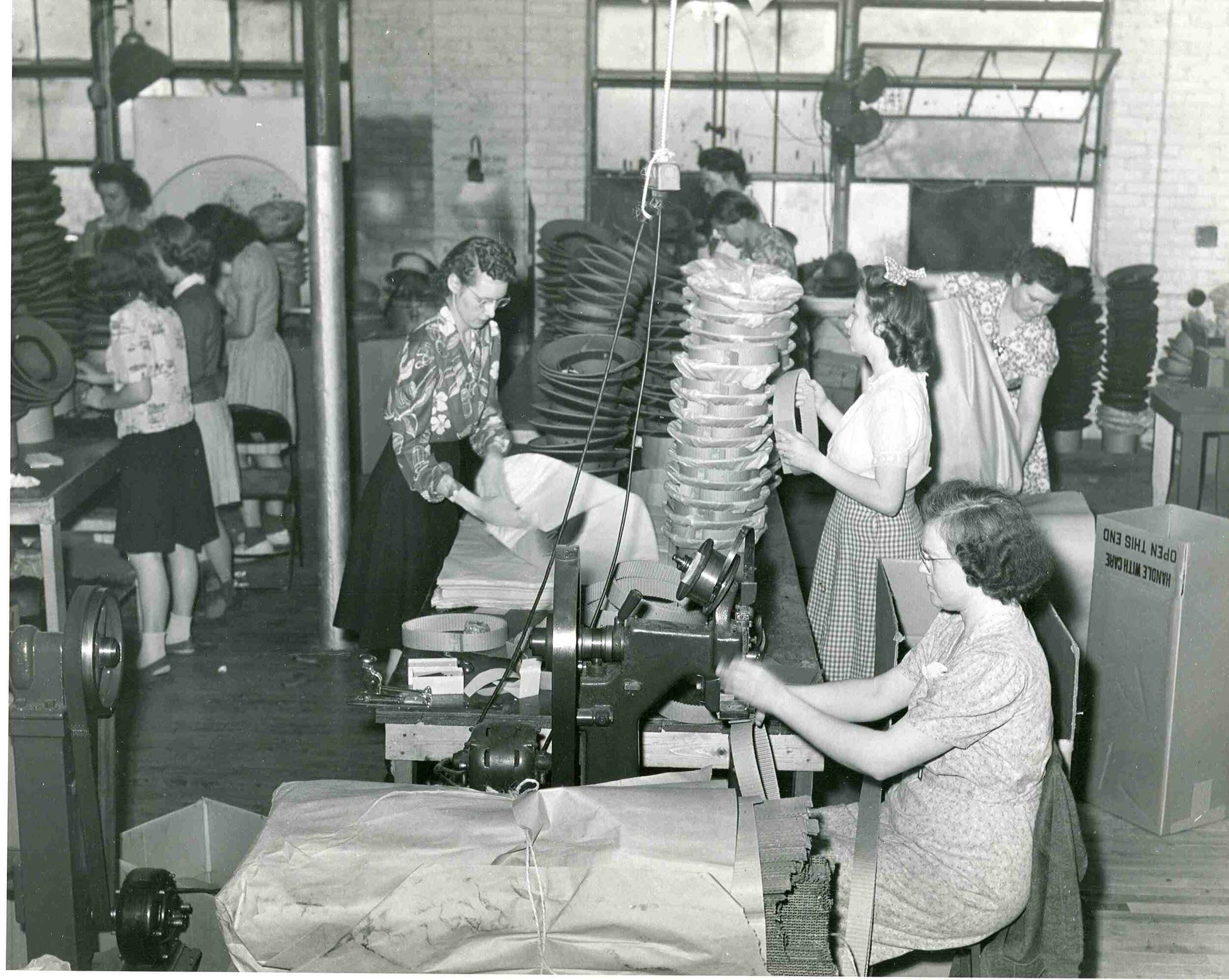 Women assembling pith helmets at St. Charles’ Newcombe-Hawley plant off of 6th street, c. 1943. 20,000 helmets a day were manufactured there during World War II, meriting it as one of St. Charles’ largest contributors to the war effort, along with Howell Manufacturing. SCHM Archives