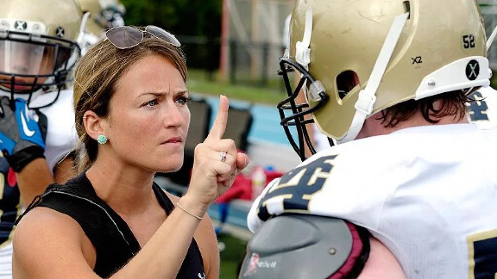 Athletic Trainer checking for concussion