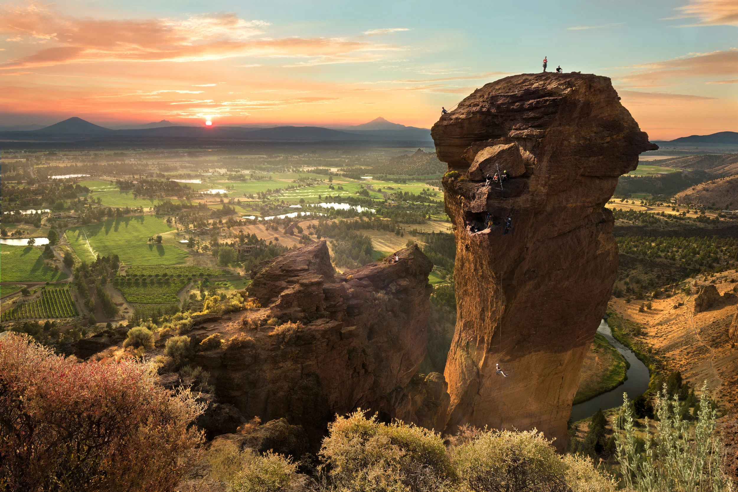 Rock climbers hanging off of Monkey Face like, well, monkeys | Sunset at Monkey Face | Smith Rock State Park | Oregon