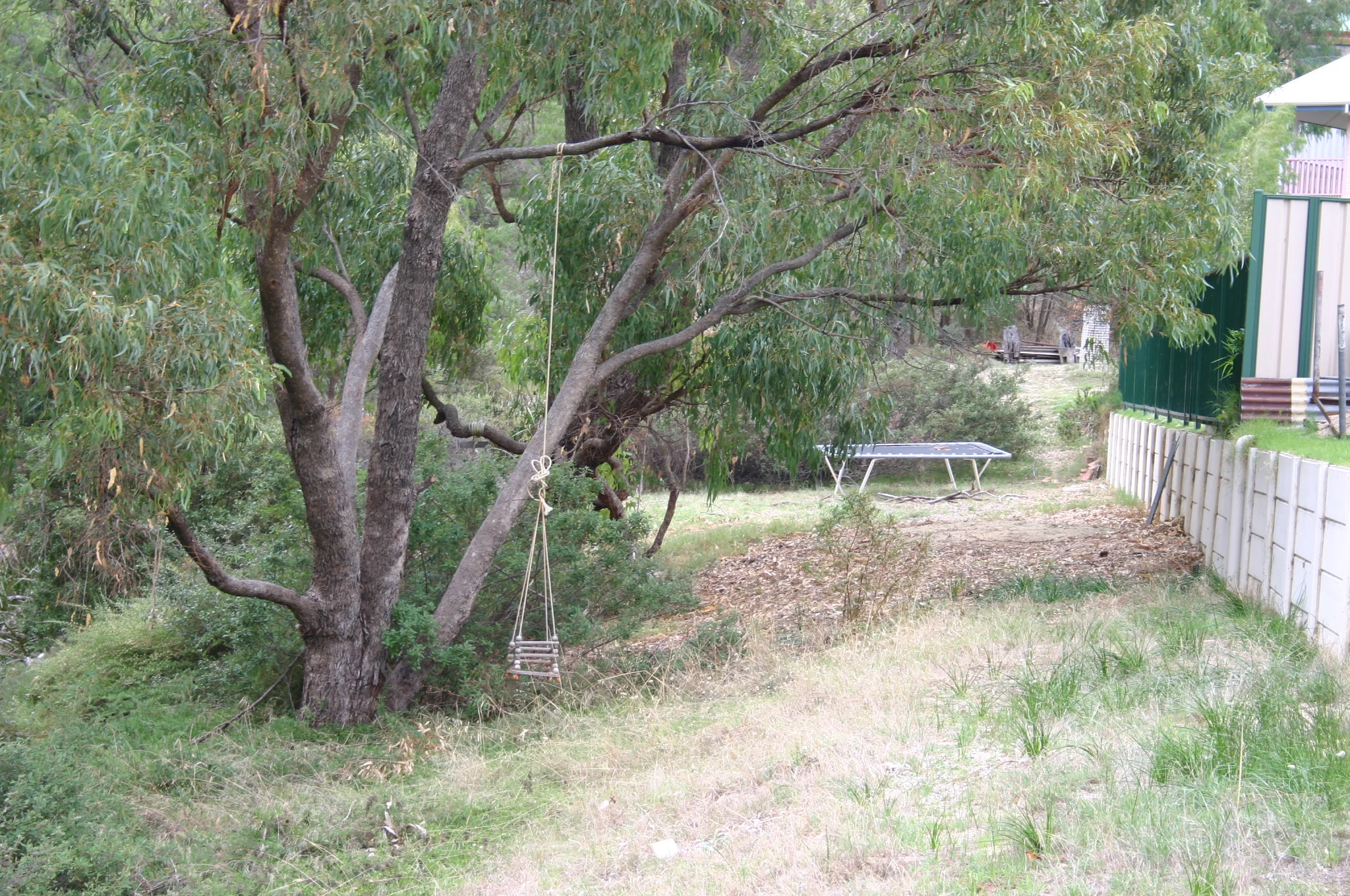 Fig 17: A resident using the adjacent public reserve to locate play equipment (Bunbury WA)