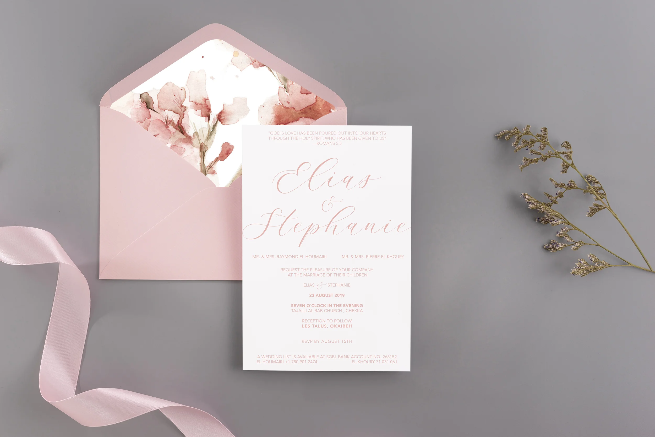 A wedding mock up concept. Wedding Invitation, envelopes, cards Papers on grey background with ribbon and decoration. Top view, flat lay, copy space