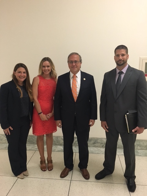 Member Emily Reichard with Allison Malmstrom (NATM), Rep. David Young and Jake Morrison (H&H Trailers)