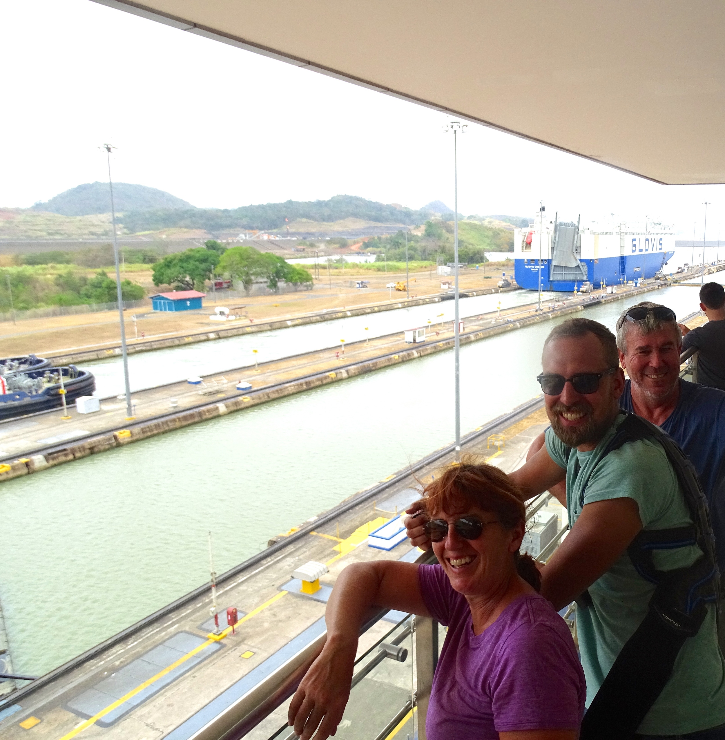 Jalene, Ondrej, and Peter in awe at the Panama Canal Locks.