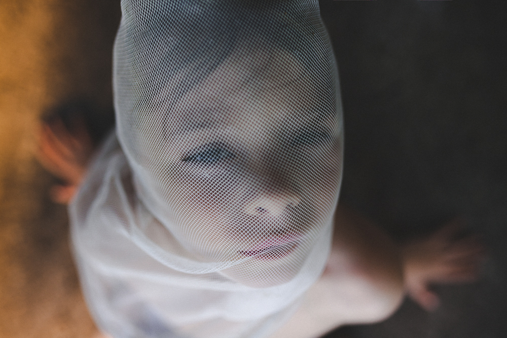 Boy under a net - Cathlin McCullough Photography