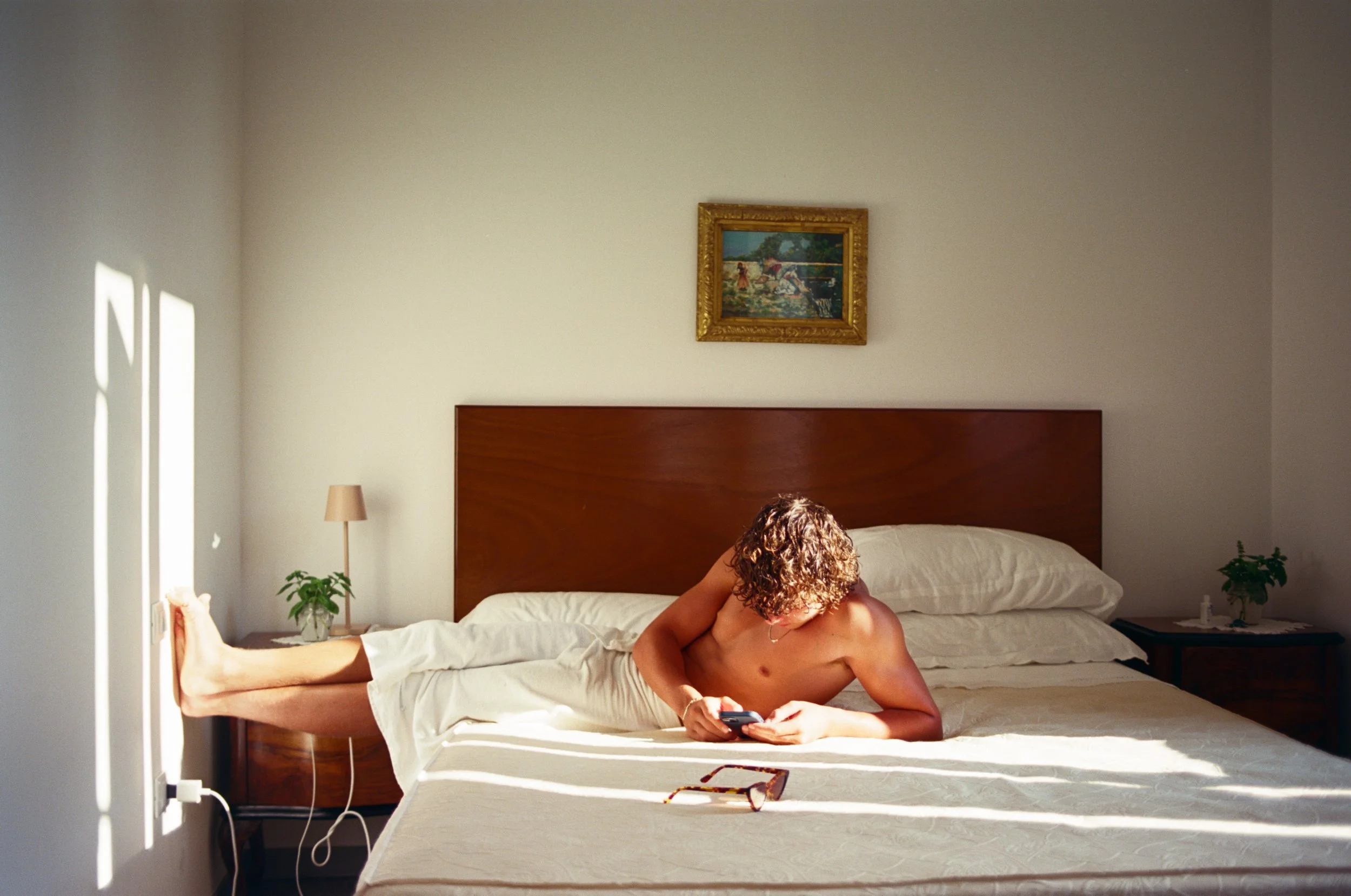 Early morning light bathes a young man in Salento Puglia, Italy