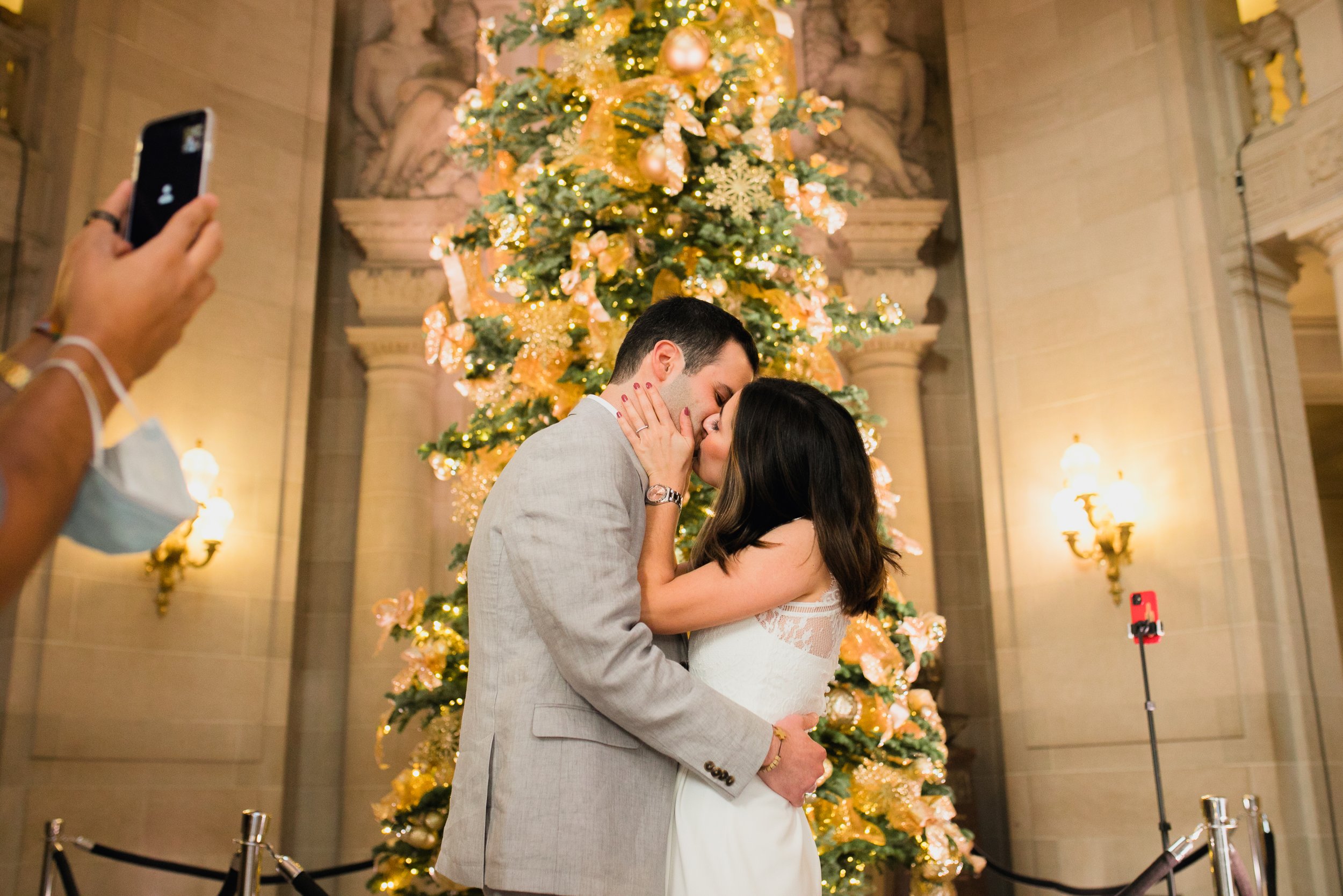 SF City Hall Covid wedding couple first kiss