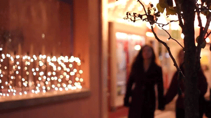 women walking down the street, holding hands.gif