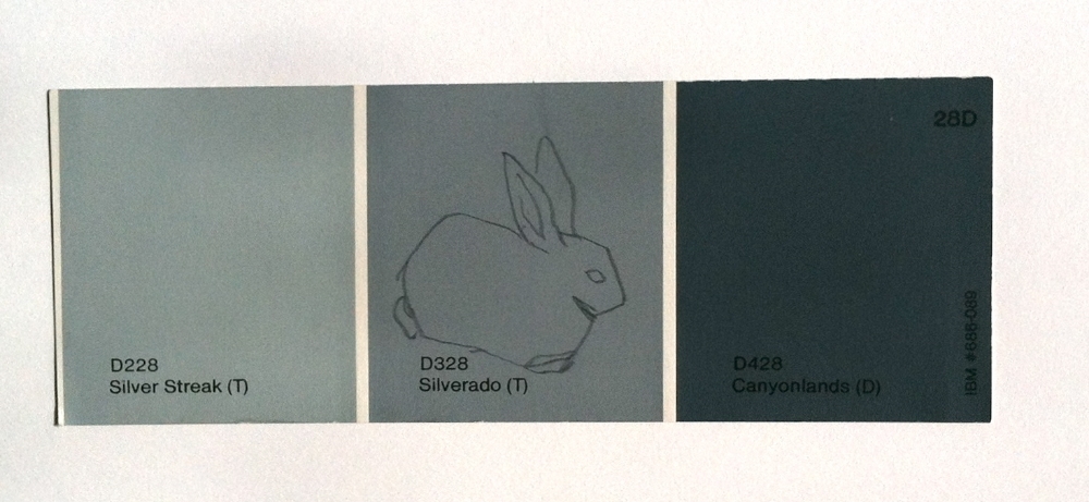 Kate Shepherd, lone rabbit on grey, 1996, graphite on paint chip 2 x 6 inches.jpg