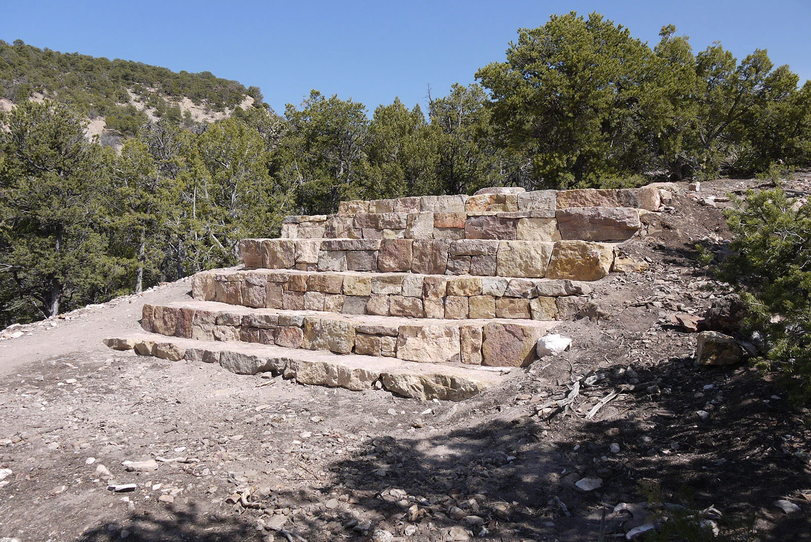 Small Amphitheater, Newspaper Points (outdoor commission for private collection in Santa Fe) , stone, steel, aluminum, paint, massive space