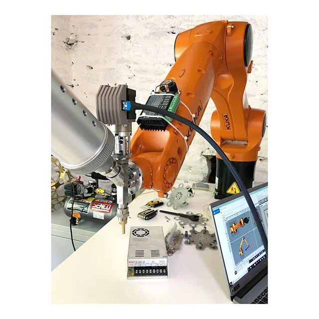 Over the last weeks we’ve been transforming our incredible KUKA Robot into a tool to print ceramics. We’ve been collaborating with Autodesk and Aerospace Cornwall and will be sharing the experiments and results in the weeks to come but I thought I’d share the making of the tool first because quite often the tool that makes the work is as interesting, integrated and enjoyable to build, problem solve and experiment with, as the work itself. We’re working on the integration of the software and hardware but just as important is the ability to customise the material composition by adding bio-ethanol and bio-additives etc. The ability to customise and experiment with the material which informs the design and development of the tool is incredibly valuable and an important process...and these materials are one of the most natural and reusable materials there is.. so we’re not polluting the world with our experiments. We’re excited to share the outcomes and describe more about the processes in the coming weeks..🔬🎨🤖 #kukaroboticsuk #kukarobotics #machine #making #toolsofthefuture #industry40 #art #engineering #science #additive #aerospace #innovation #technology #robot #photography #ceramics #protein #digitalcraft #digitalart #creative #industry #industrialdesign #architecture #product #ceramics #kiln #porcelain #autodesk