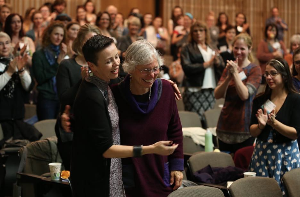 Martha Richards and Statera’s Deputy Director, Shelly Gaza, make their way to the podium.