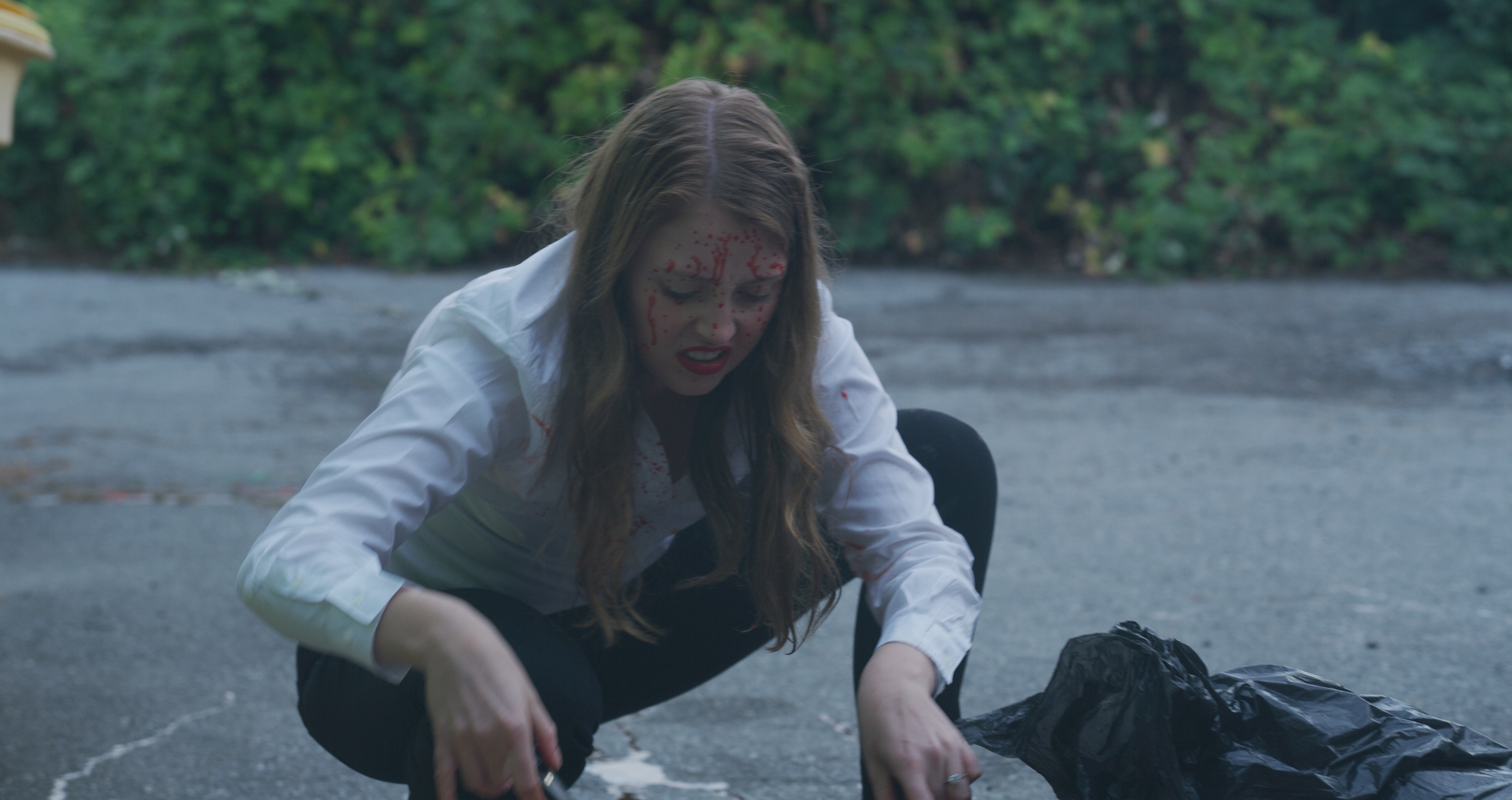 Aleita Northey as Anna Gowan, picking up guts in episode 4 of This Blows.