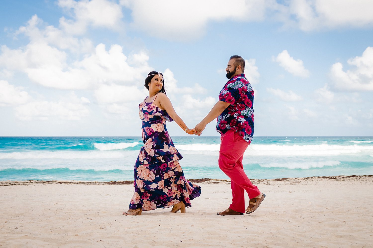 cute couple walking on the beach.jpg