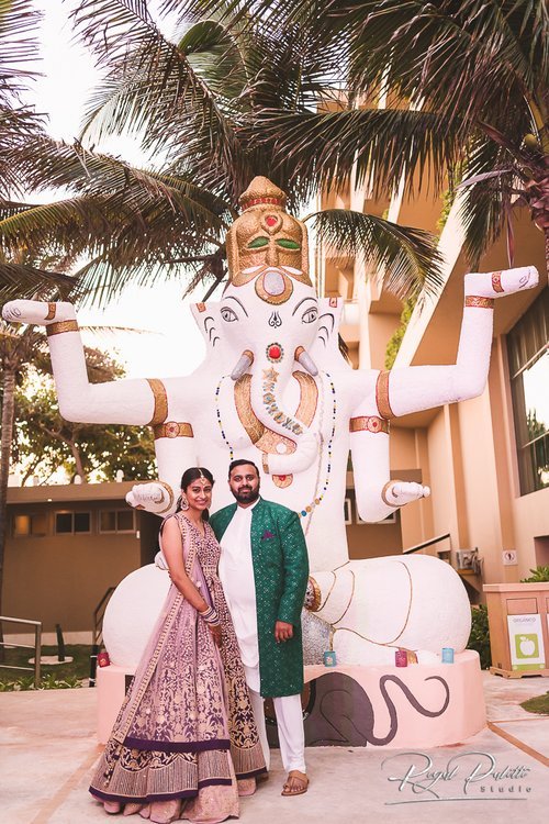 indian couple with ganesh statue.jpg