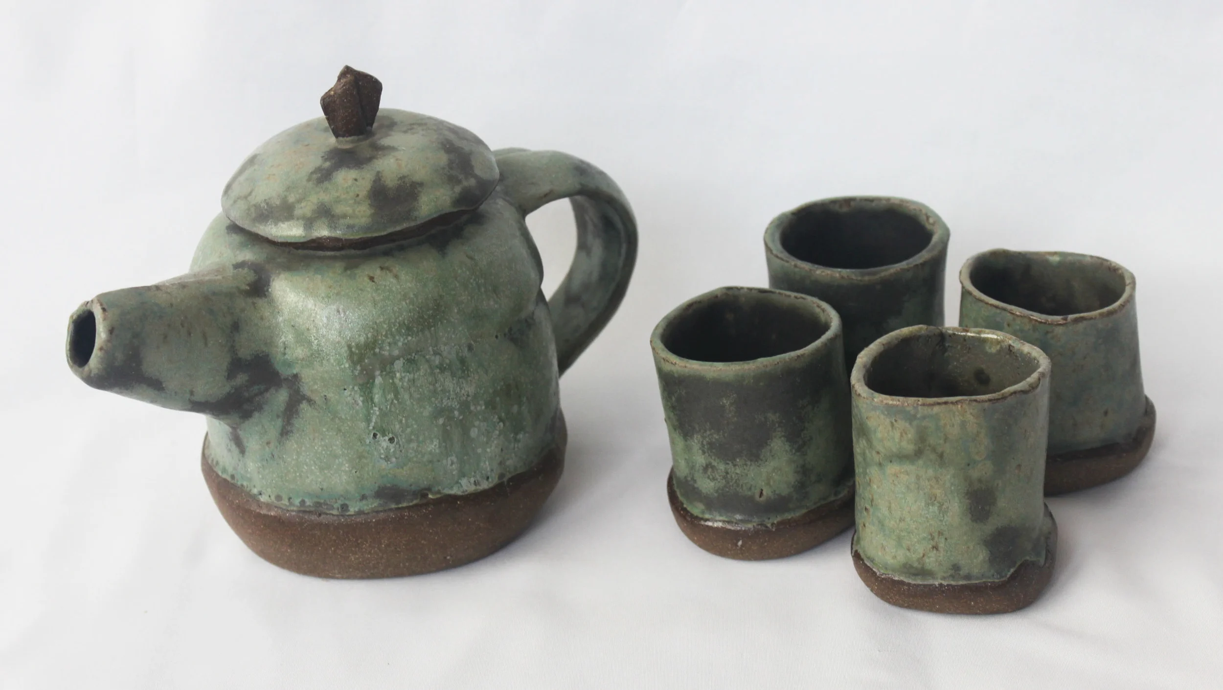 Hand work tea kettle and cups