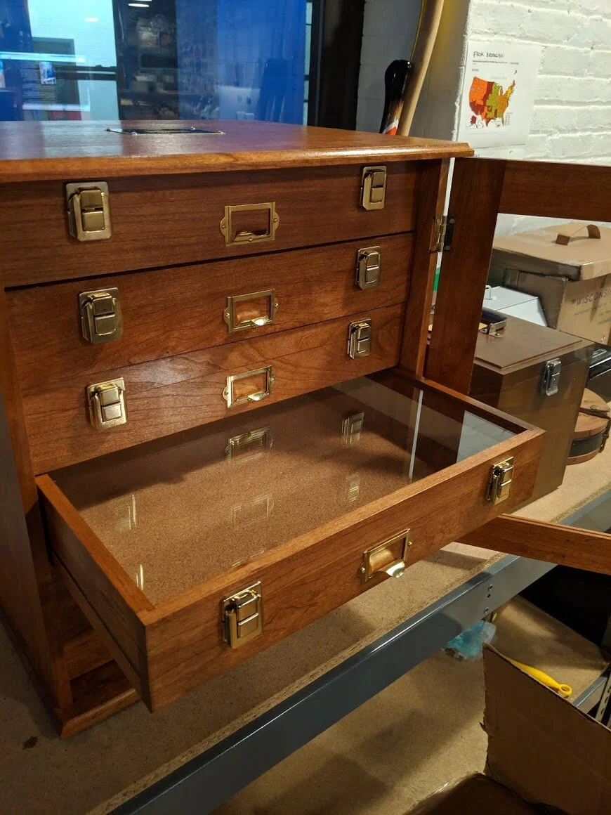 Glass topped drawers allow you to see the specimens within. The bottom of the boxes were lined with cork so that specimens could easily be pinned inside