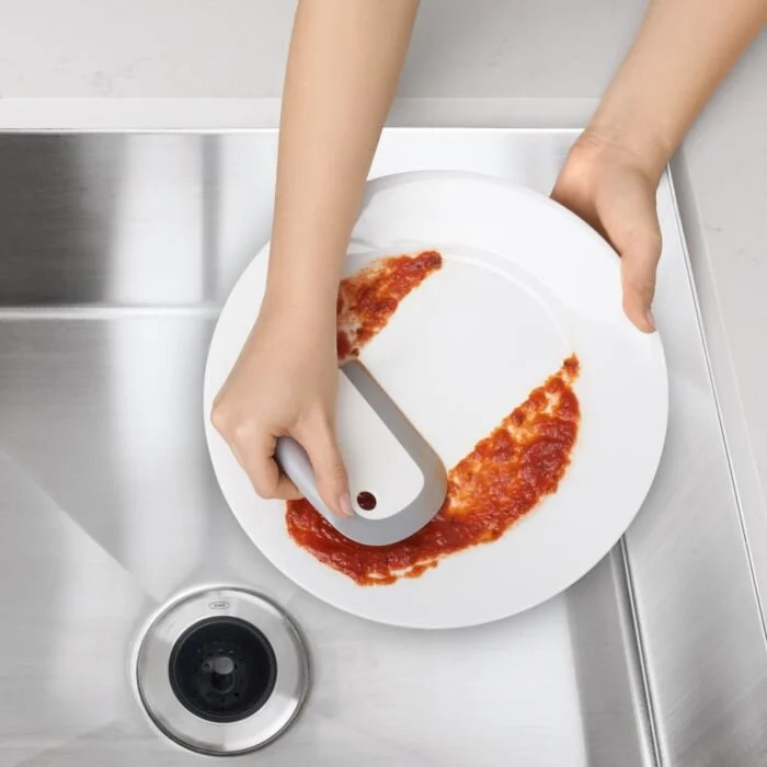The flexible silicone and the combination of flat and curved edges makes it easy to clear leftover food from plates and bowls
