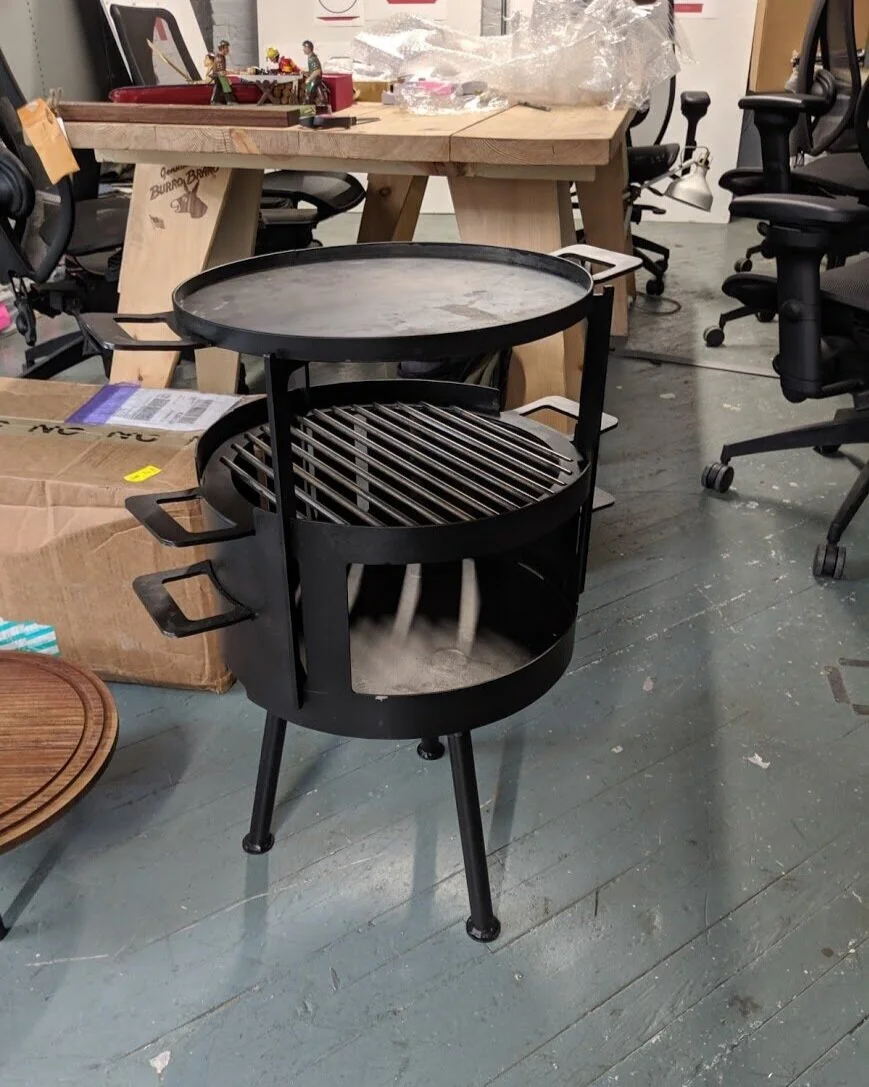 The signature functionality of this grill is the ability to a do an “little inferno” cooking method. By stacking the plancha above the grill the user can build a fire above and below the food they are cooking in order to make an open air oven