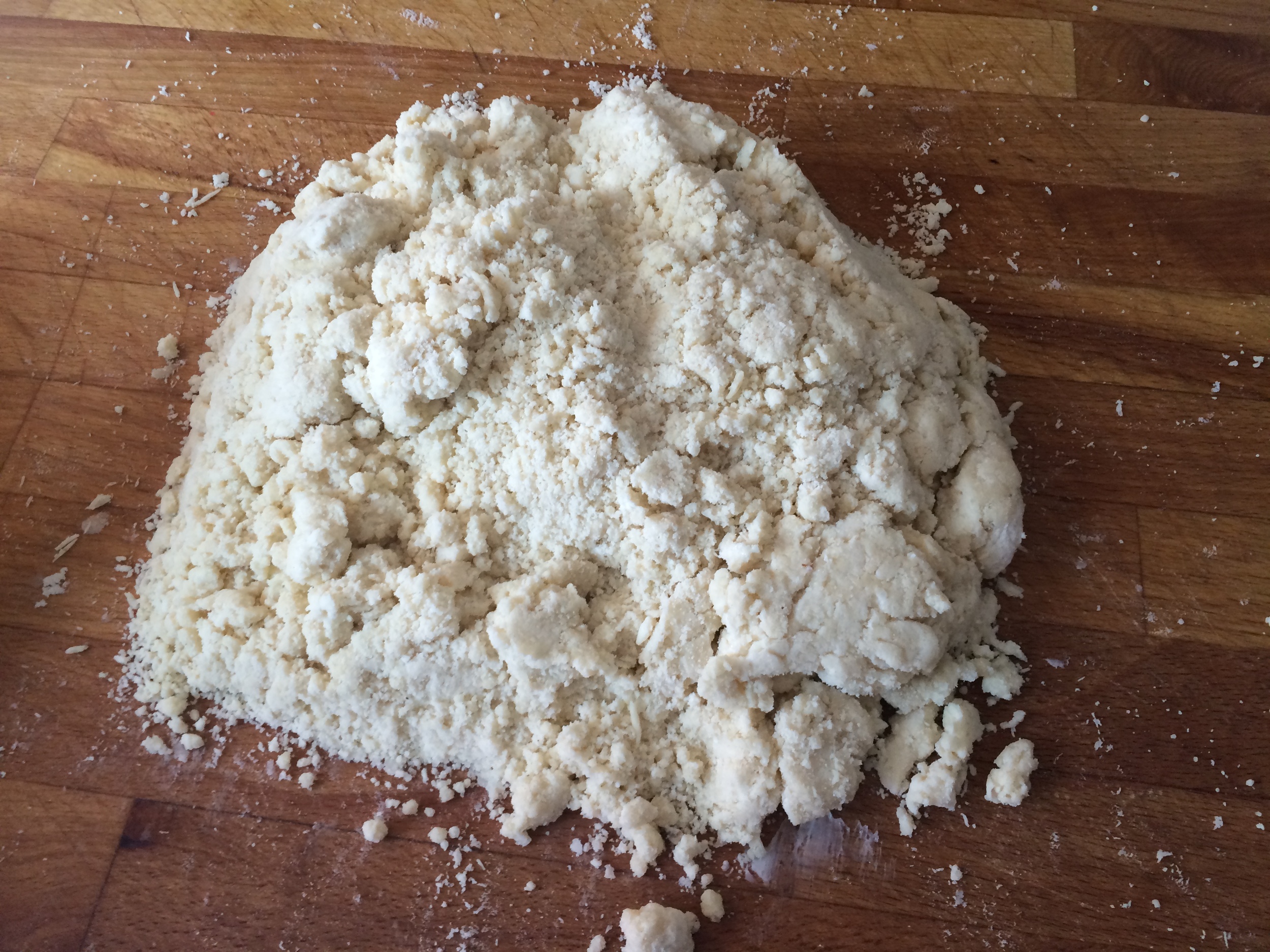 Pie "dough" isn't a dough yet. Use you hands to pack it all together and place in fridge.